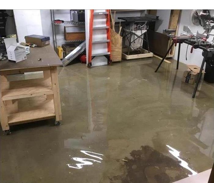 Flooded workshop with various contents