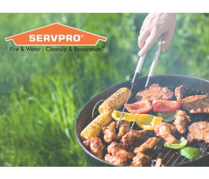 Image of a grill with food and a SERVPRO logo